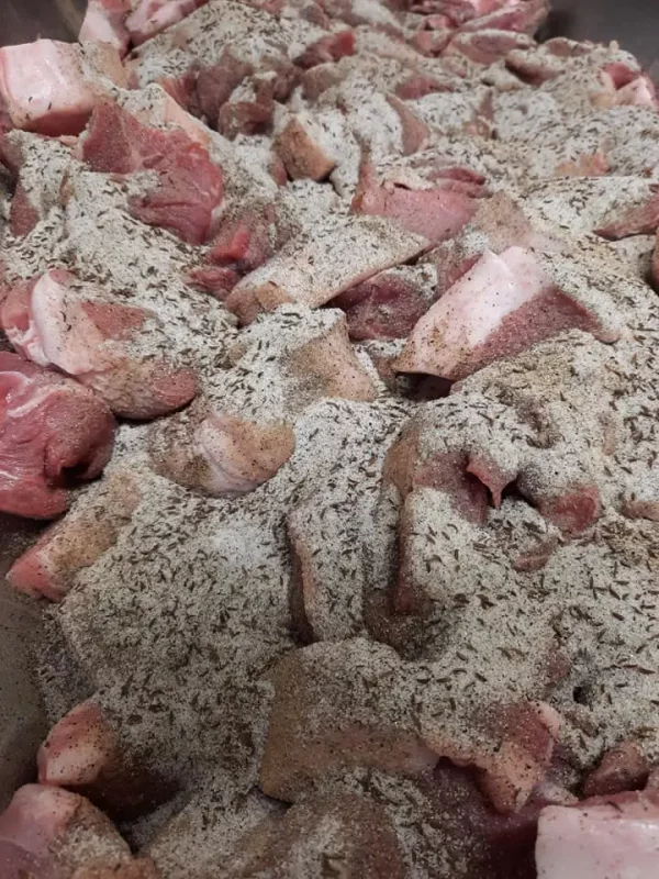 a pile of meat with spices